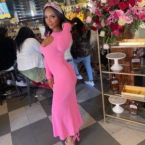 Long pink maxi sweater dress with cut out in front.
